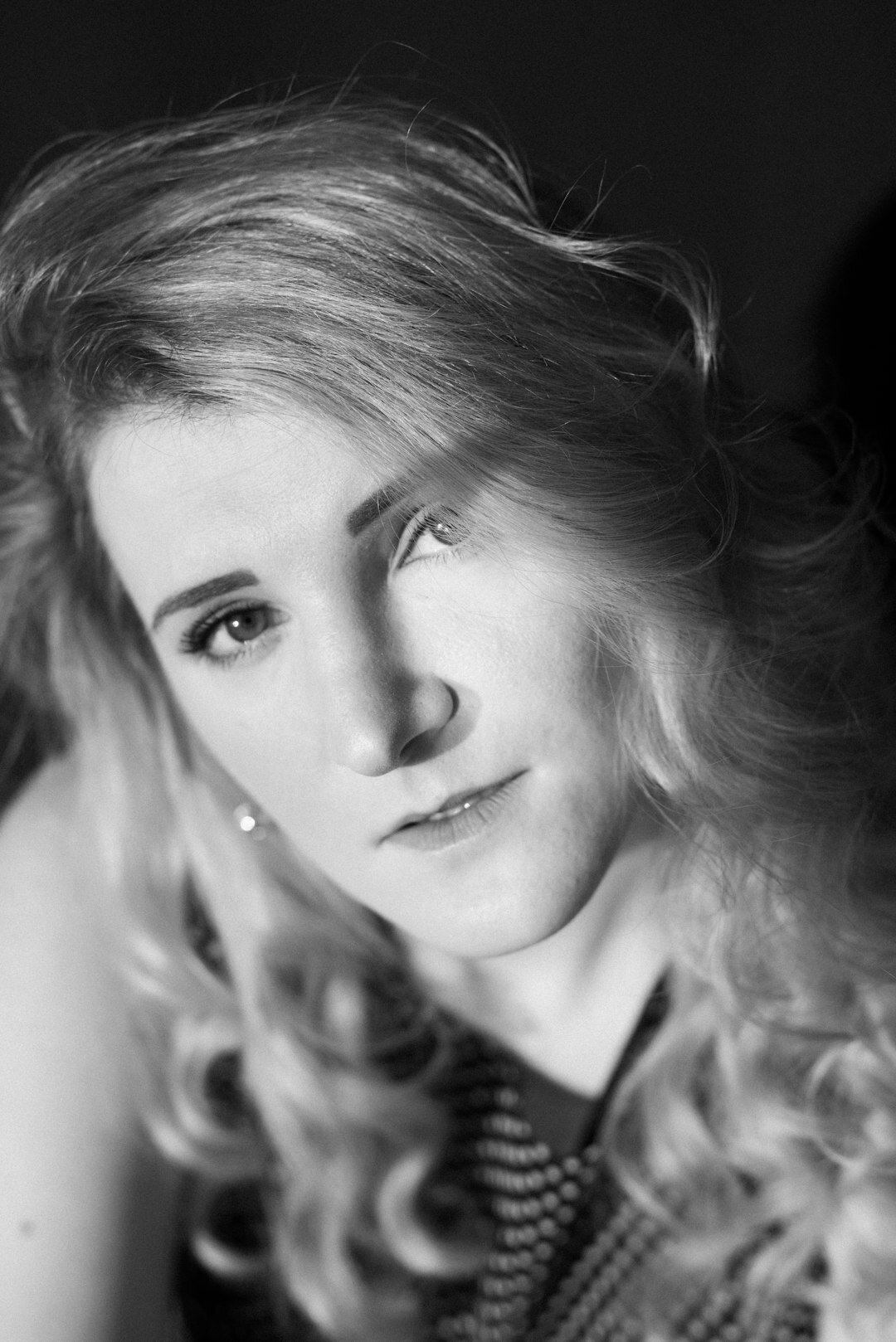 Studio portrait of a young European woman, video editing specialist