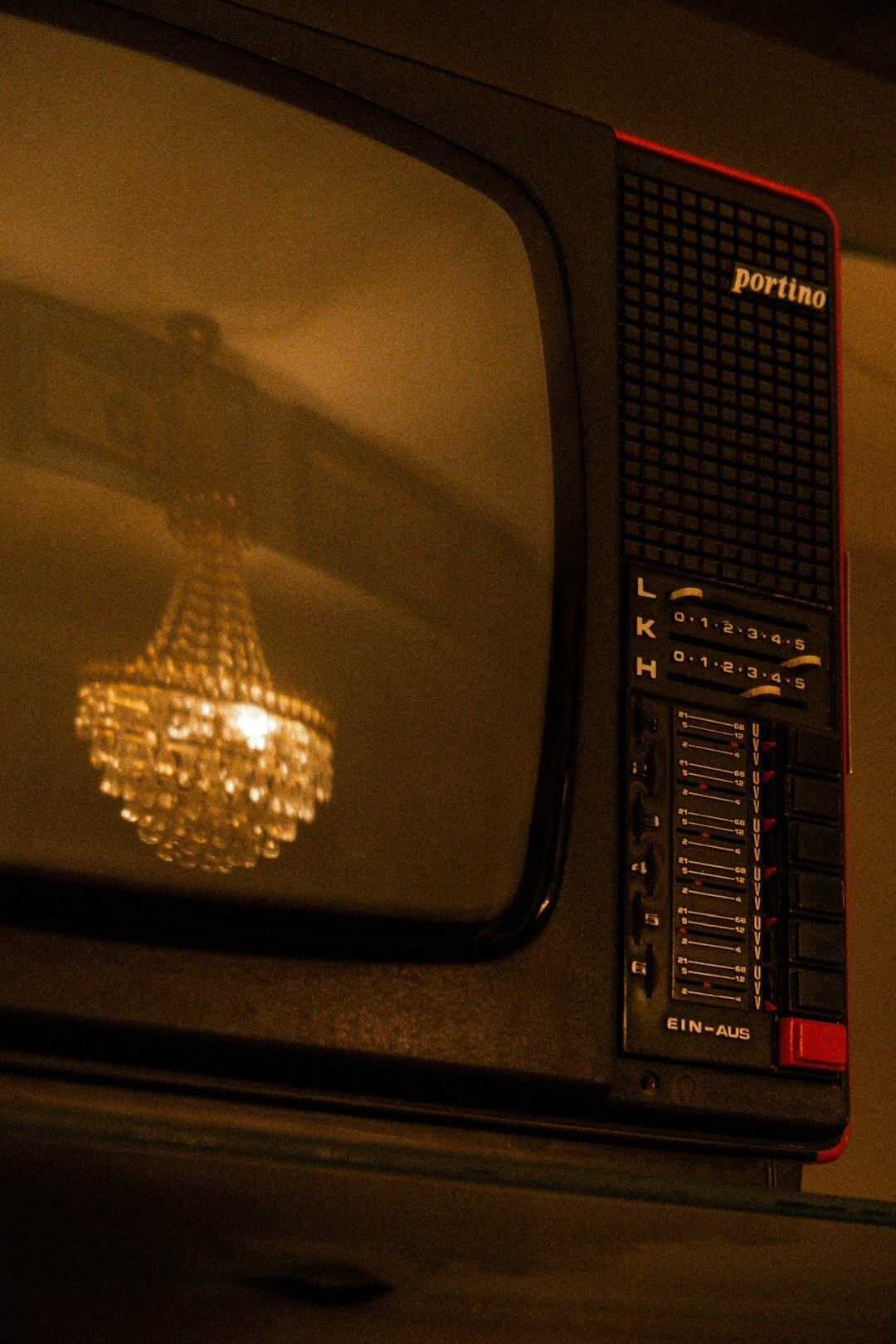 Vintage television set glowing in a dim room, evoking 1980s broadcast advertising